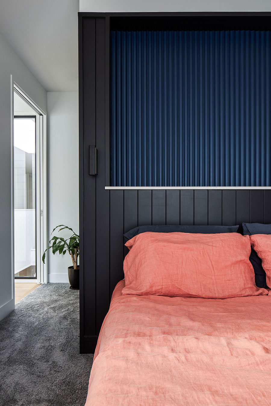 SMITH Architects modern family home coloured paneling bedhead
