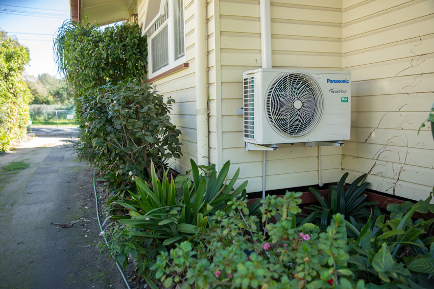 elevated or raised air conditioning unit for flood-resilience