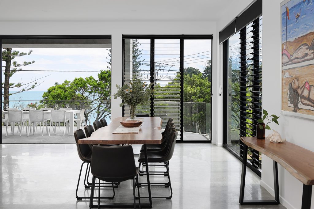 Modern-beach-house-Margaret-st-Kings-beach-by-the-shores-of-Caloundra-Sunshine-Coast-dining-area-and-gallery-from-the-entrance