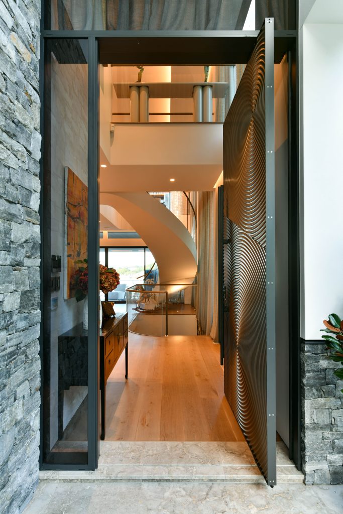 Luxury-home-renovation-by-Hampton-Homes-Australia-pivot-door-entrance