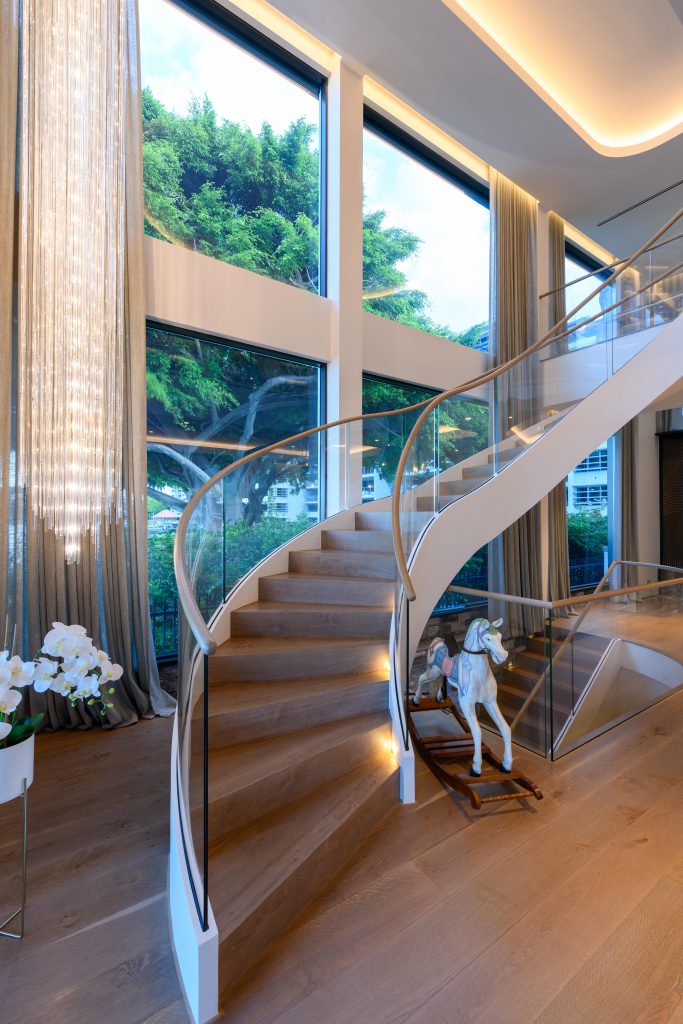 Luxury-home-renovation-by-Hampton-Homes-Australia-staircase-with-curved-glass