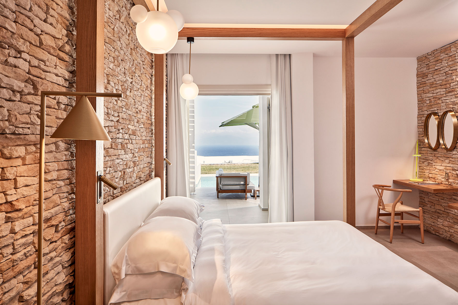Naia Mykonos - bedroom with views of the beach
