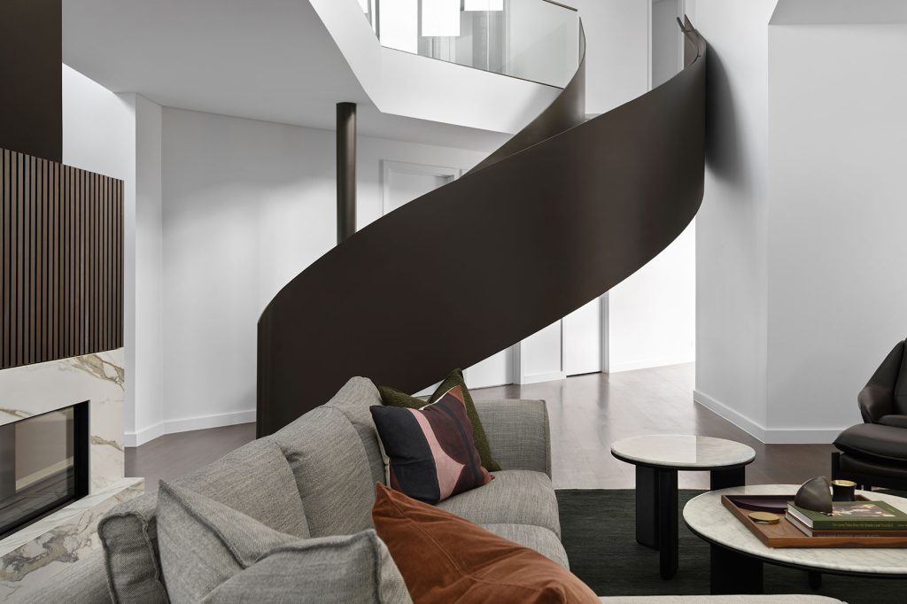 Studio James Interiors - living room area with view of the spiral staircase