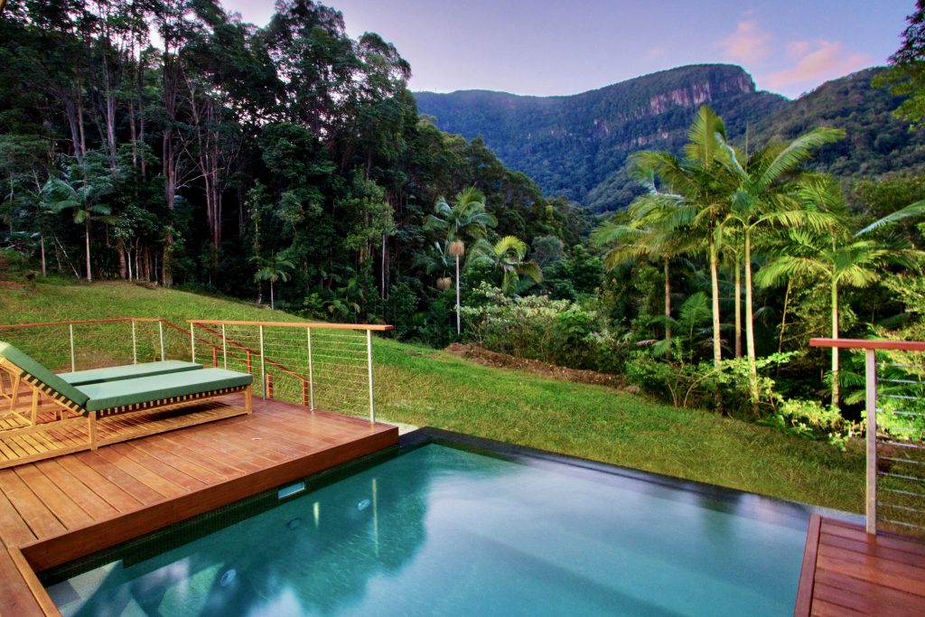 Rainforest mountain view in the Byron Bay Hinterland from the beautiful pool deck of private luxury resort accommodation.